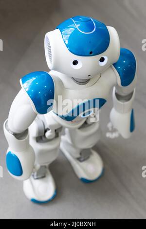 Small robot with human face and body. AI Stock Photo