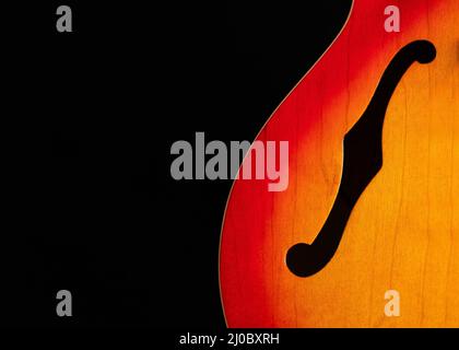 Partial view of Epiphone Dot on black showing f hole Stock Photo