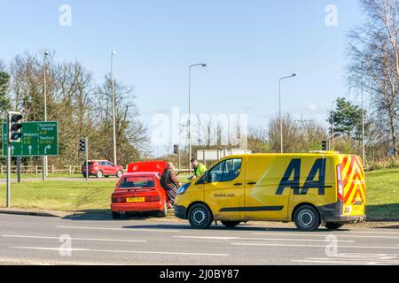 An AA van attending a breakdown on a large roundabout in King's Lynn, Norfolk. Stock Photo