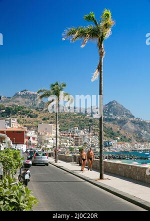 The main tourist promenade of Giardini Naxos on the island of Sicily Italy Stock Photo