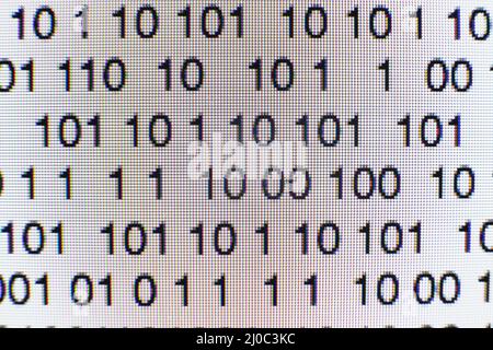 Binary code on a computer screen Stock Photo