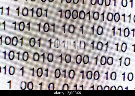 Binary code on a computer screen Stock Photo