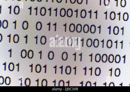 Binary code on a computer screen Stock Photo