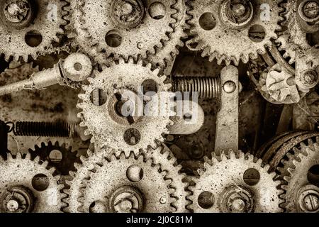 Retro styled image of the innerworks of an old machine with cogs and gears Stock Photo