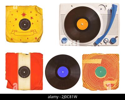 Old vinyl turntable player with record albums isolated on white Stock Photo