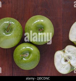 Green ripe apples and apple slices cut Stock Photo