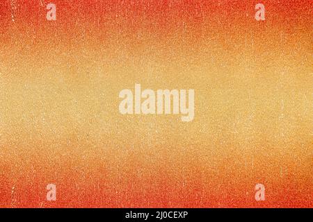Close up of rough texture of shiny metallic crepe paper or foil colored in red, orange and yellow gold gradient. Abstract background with large copy s Stock Photo