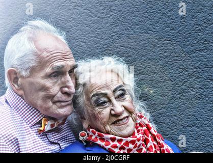 Older people, a married couple in elegant clothes and a festive makeover. Gold wedding. Concept: ann Stock Photo