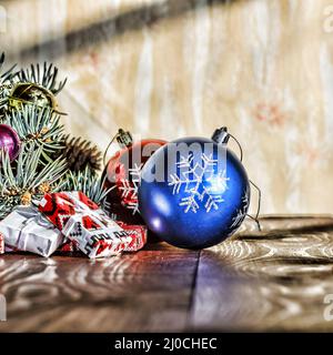 A New Year, Christmas. Christmas decorations, multi-colored balls and gifts with a Christmas tree on Stock Photo
