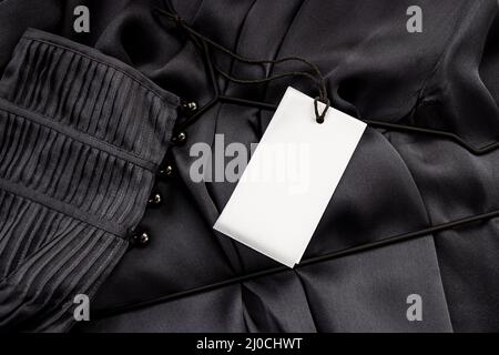 mock up, Empty label for text in white color on a gray silk blouse with buttons Stock Photo