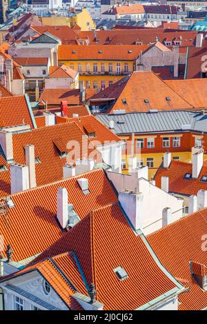Tiled roofs with chimneys in the Old Town of Prague, Czechia Stock Photo