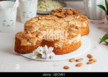 Colomba - traditional italian easter dove cake with glaze, macaranage, almonds Stock Photo