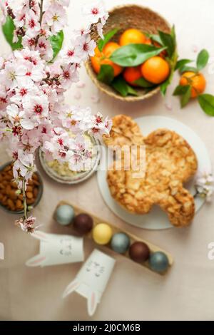 Colomba - traditional italian easter dove cake with glaze, macaranage, almonds Stock Photo