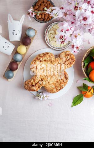 Colomba - traditional italian easter dove cake with glaze, macaranage, almonds Stock Photo