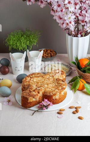 Colomba - traditional italian easter dove cake with glaze, macaranage, almonds Stock Photo
