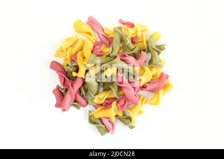 Pile of colorful campanelle pasta isolated on white background. Uncooked raw italian pasta Stock Photo