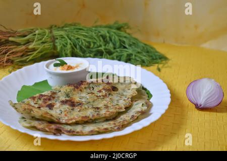 A Selective focus Picture of Karnataka's favorite Delicacy called Akki Rotti on a table Stock Photo