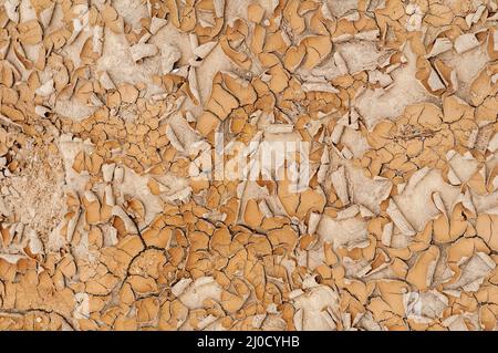 Full frame of dried and flaking sandy-coloured river bed Stock Photo