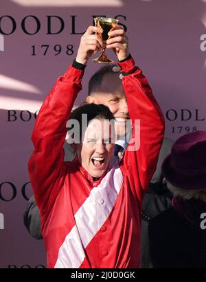 Rachael Blackmore celebrates with the Gold Cup trophy after winning the Boodles Cheltenham Gold Cup Chase on A Plus Tard during day four of the Cheltenham Festival at Cheltenham Racecourse. Picture date: Friday March 18, 2022. Stock Photo