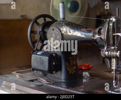 Vintage sewing machine on the table in Jakarta, Indonesia Stock Photo