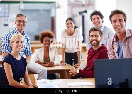 Were making it happen. Portrait of a group of diverse designers in their modern office. Stock Photo