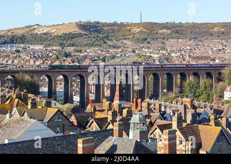The Famous Flying Scotsman steam locomotive owned by the National Railway Museum passes over a viaduct across Folkestone, from London via Canterbury, Stock Photo