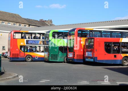 Stagecoach buses at stands in Lancaster bus station with furthest bus backing out from it's stand ready to depart on 18th March 2022. Stock Photo