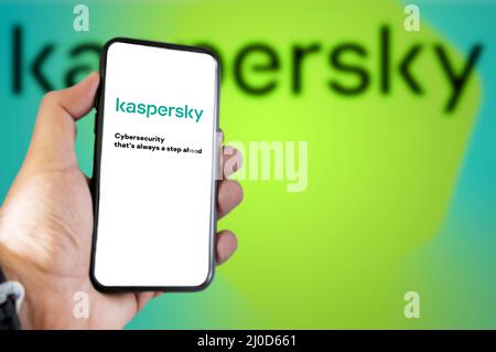 Rome, Italy, March 2022: the logo of the Kaspersky antivirus on the screen of a hand-held mobile phone. Kaspersky is a Russian company specializing in Stock Photo