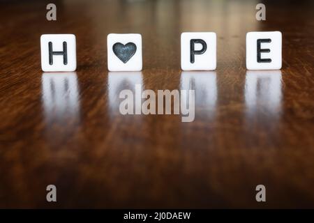 HOPE text word message in 3D. Isolated, Hope word with reflections. Stock Photo