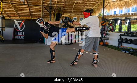 Cabarete, Puerto Plata, Dominican republic, 12.03.2022. Kickboxing at school under a canopy. Spaving, boxing. Gym. Wide angle, High quality photo -5 Stock Photo