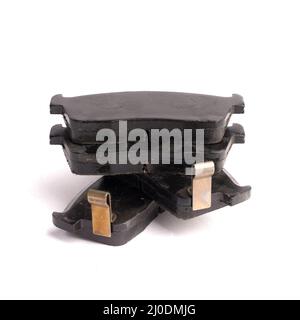 Set of 4 pieces of new front disc brake pads, isolated on white Stock Photo
