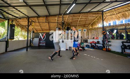 Cabarete, Puerto Plata, Dominican republic, 12.03.2022. Kickboxing at school under a canopy. Spaving, boxing. Gym. Wide angle, High quality photo -5 Stock Photo