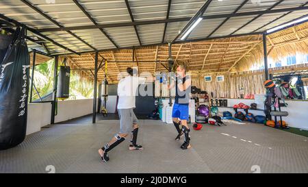 Cabarete, Puerto Plata, Dominican republic, 12.03.2022. Kickboxing at school under a canopy. Spaving, boxing. Gym. Wide angle, High quality photo -5 Stock Photo