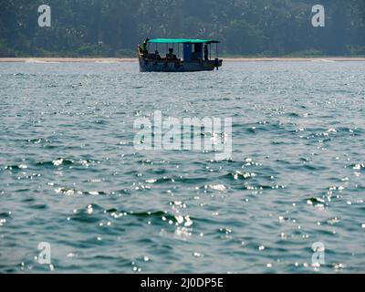 Malvan, INDIA - December 23, 2021 : Unidentified tourists enjoying boat ride in  Devbagh beach, Sindhudurga, a place listed in 30 favorite tourist des Stock Photo