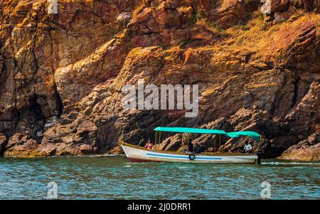 Malvan, INDIA - December 23, 2021 : Unidentified tourists enjoying boat ride in  Devbagh beach, Sindhudurga, a place listed in 30 favorite tourist des Stock Photo