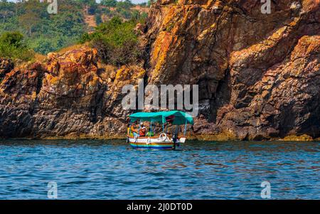 Malvan, INDIA - December 23, 2021 : Unidentified tourists enjoying boat ride in  Devbagh beach, Sindhudurga, a place listed in 30 favorite tourist des Stock Photo