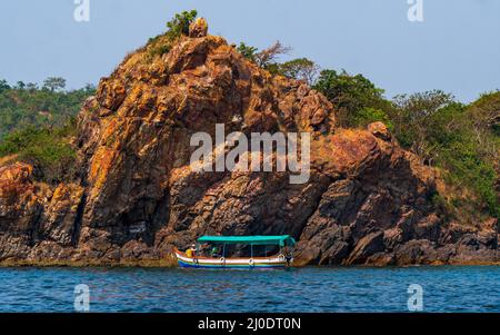 Malvan, INDIA - December 23, 2021 : Unidentified tourists enjoying boat ride in  Devbagh beach, Sindhudurga, a place listed in 30 favorite tourist des Stock Photo