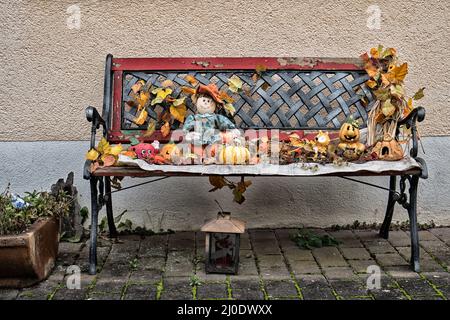 An old bench in the autumn decoration. Stock Photo