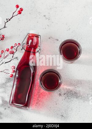 alcoholic drinks with sweet cherry on glass table Stock Photo - Alamy