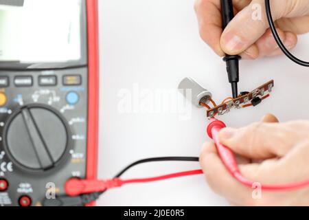 Measuring an electrical capaciter Stock Photo