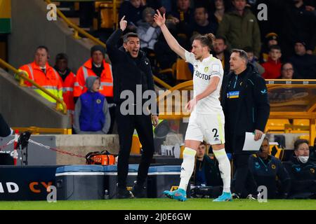 Wolverhampton, UK. 18th Mar, 2022. 18th March 2022;  Molineux Stadium, Wolverhampton, West Midlands, England; Premier League Football; Wolverhampton Wanderers versus Leeds United; Luke Ayling of Leeds United and Wolverhampton Wanderes Head Coach Bruno Lage both appeal for a throw-in Credit: Action Plus Sports Images/Alamy Live News Stock Photo