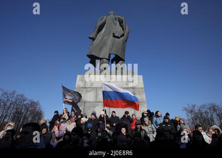 Moscow, Russia. 18th Mar, 2022. 18 March 2022, Russia, Moskau: People hold flags on the sidelines of a concert to celebrate the eighth anniversary of the annexation of the Black Sea peninsula of Crimea on March 18, 2014. Credit: dpa picture alliance/Alamy Live News Stock Photo