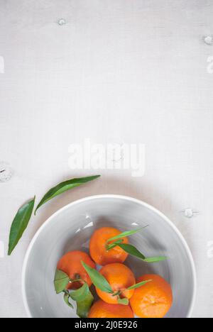Tangerines on white wooden background. Great for book cover Stock Photo