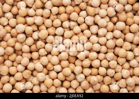 Raw chickpeas background. Chickpeas texture, top view. Stock Photo