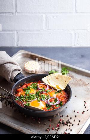 Shakshuka with pita bread Stock Photo