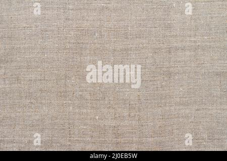Natural linen fabric, background or texture, natural gray beige color, top view, close up, horizontal Stock Photo