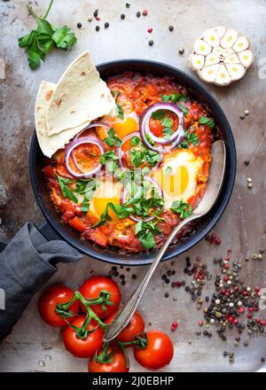 Shakshuka with pita bread Stock Photo