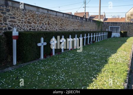 Le Mans, France - February 27, 2022: The west cemetery in Le Mans contains Belgium, French,American, Polish, Commonwealth and German graves.  Sunny wi Stock Photo