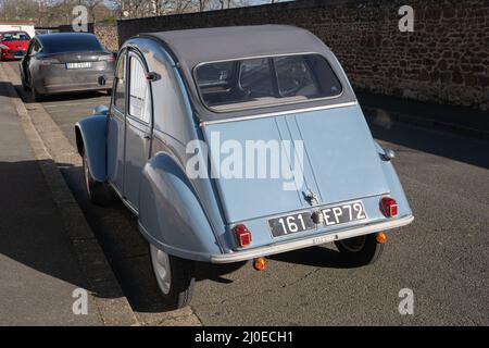 Le Mans, France - February 27, 2022: An old blue old timer classic Citroen 2CV (Dodoche) car in a very good shape. Parked in Le Mans street. French li Stock Photo