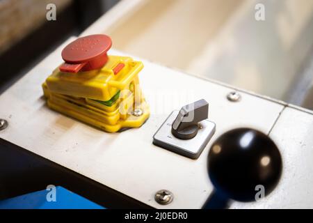 red ignition button of a milling machine Stock Photo